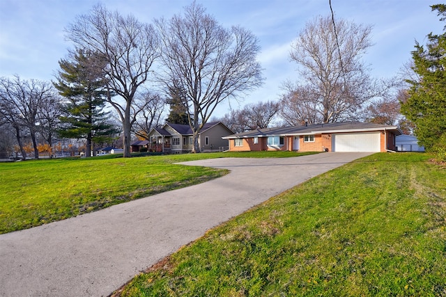 single story home with a garage and a front lawn