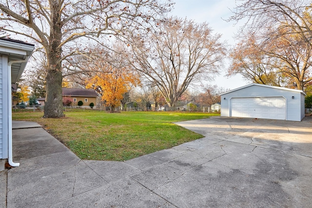 view of yard with an outbuilding and a garage