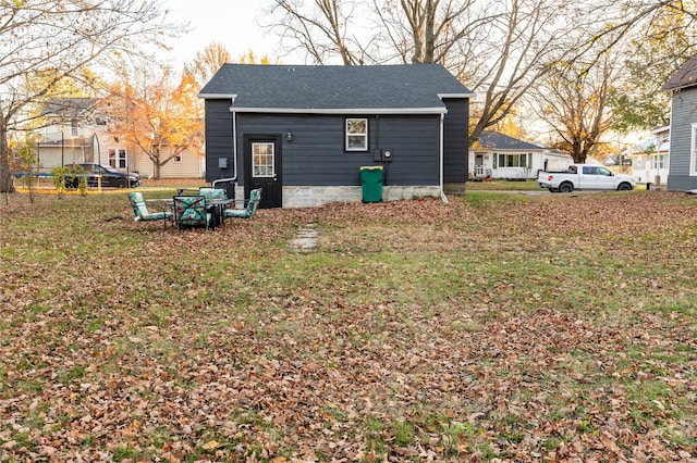 view of side of home with a lawn