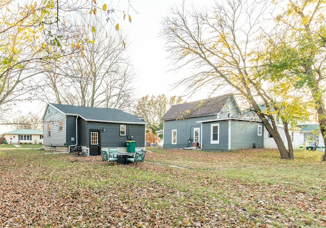 rear view of house with a lawn