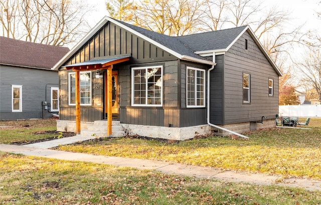 view of side of property with a yard