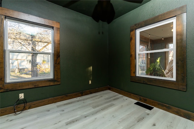 spare room featuring light hardwood / wood-style flooring