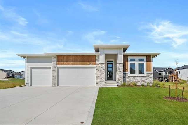 view of front facade with a front lawn and a garage