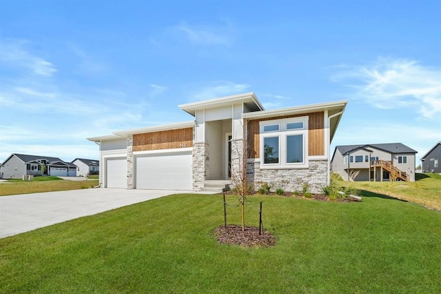 view of front of home featuring a garage and a front yard