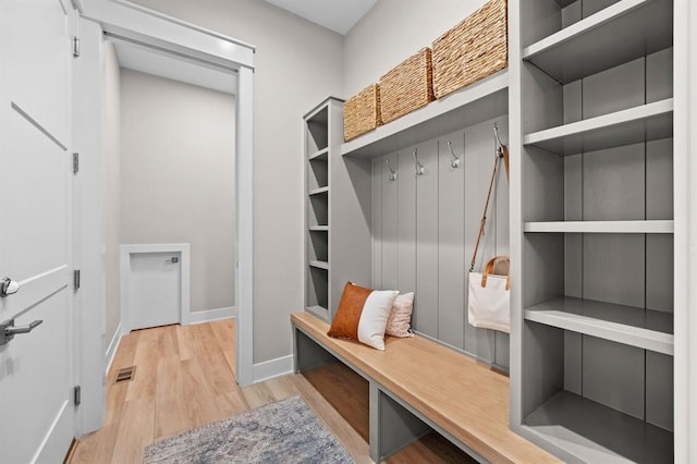 mudroom with light hardwood / wood-style floors