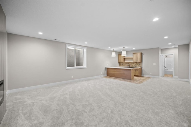 unfurnished living room with light carpet