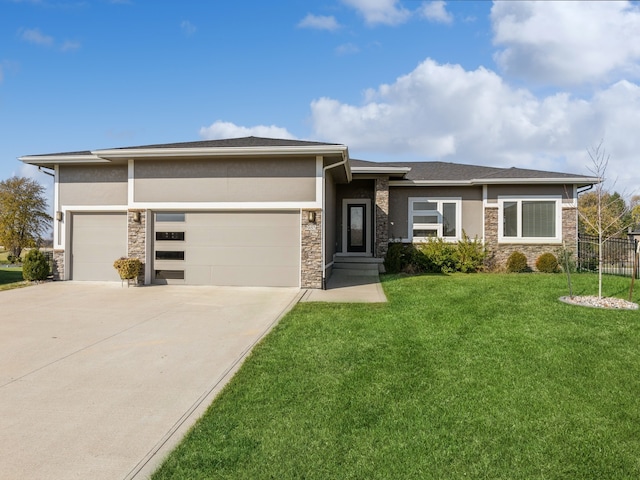 prairie-style home with a garage and a front yard