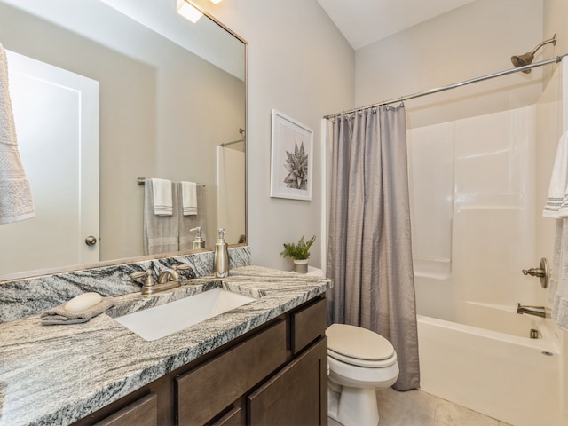 full bathroom featuring vanity, shower / tub combo with curtain, tile patterned floors, and toilet