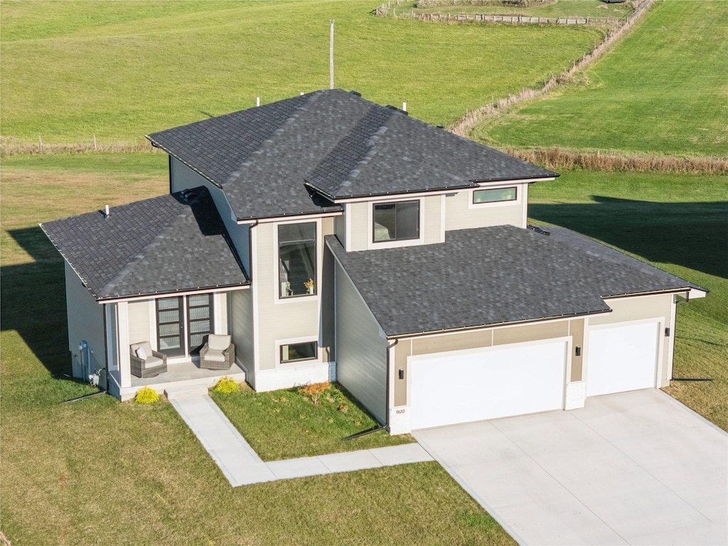 view of front of house with a garage and a front yard