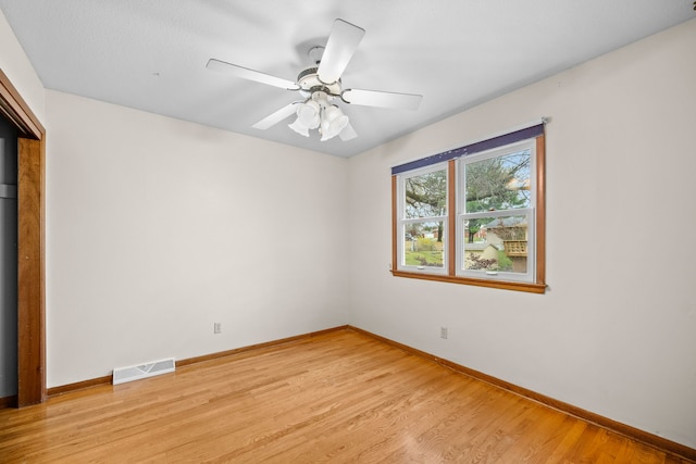 unfurnished room featuring ceiling fan and light wood-type flooring