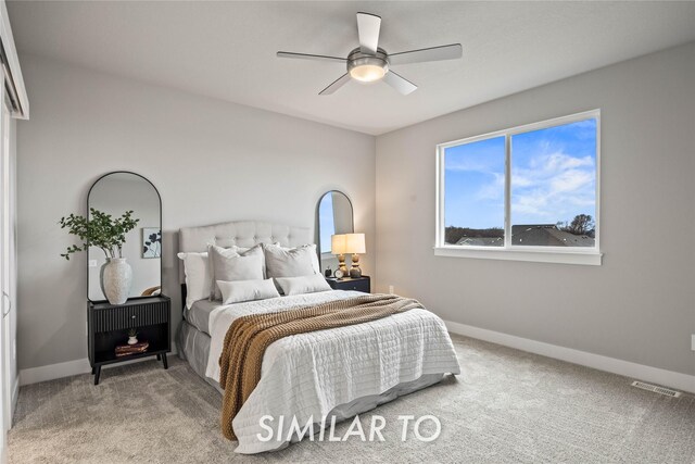 bedroom with ceiling fan and carpet flooring