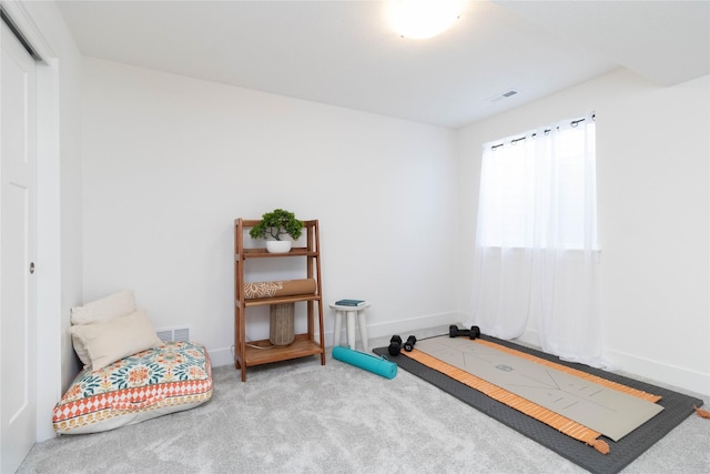 carpeted bedroom featuring baseboards
