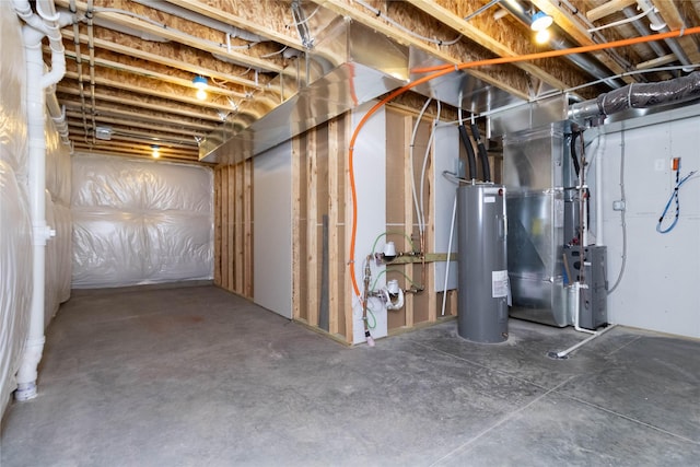 unfinished below grade area with electric water heater and heating unit
