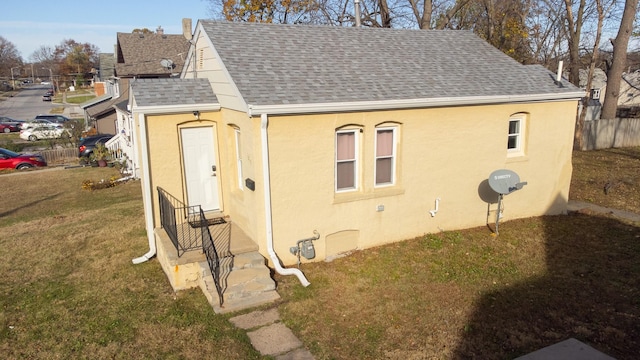 view of outbuilding with fence