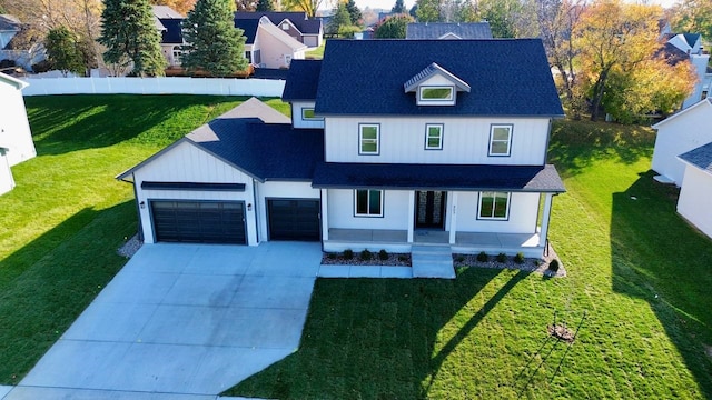 view of front of home with a garage and a front yard