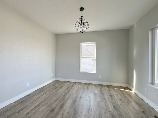 unfurnished room featuring light hardwood / wood-style floors