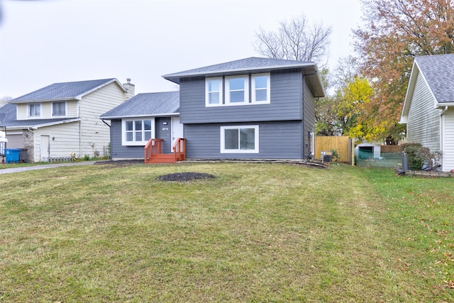 view of front facade with central AC and a front lawn