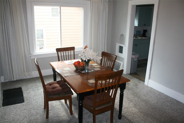 view of carpeted dining area