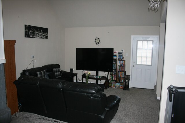 living room with carpet and vaulted ceiling