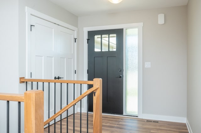 entrance foyer featuring dark hardwood / wood-style floors