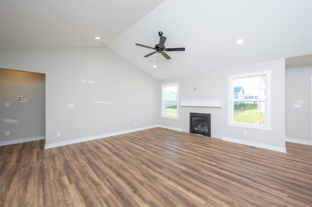 unfurnished living room featuring lofted ceiling, dark hardwood / wood-style floors, and ceiling fan