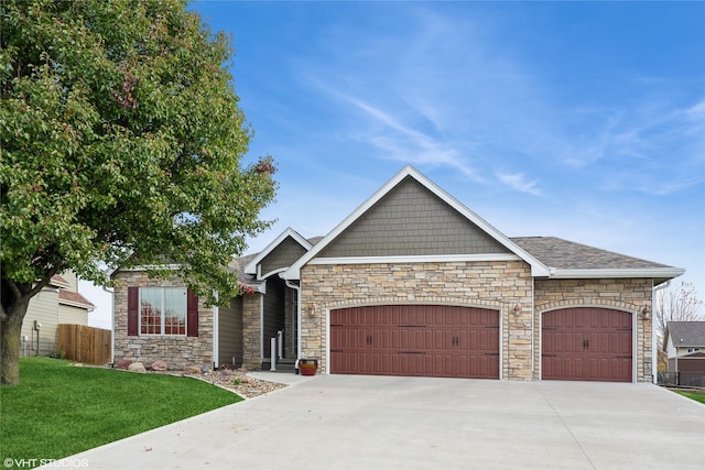 view of front of house with a garage and a front lawn