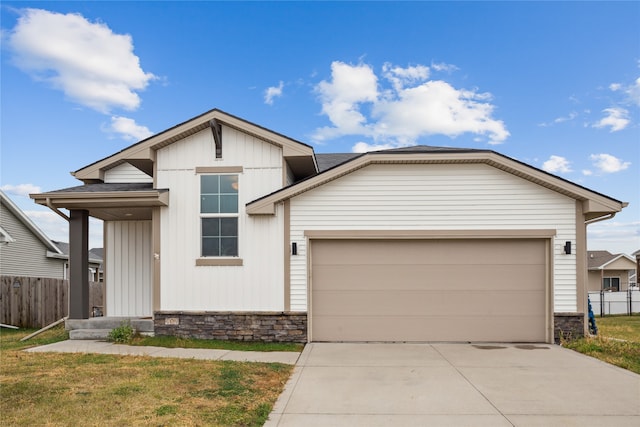 view of front of home featuring a garage and a front lawn