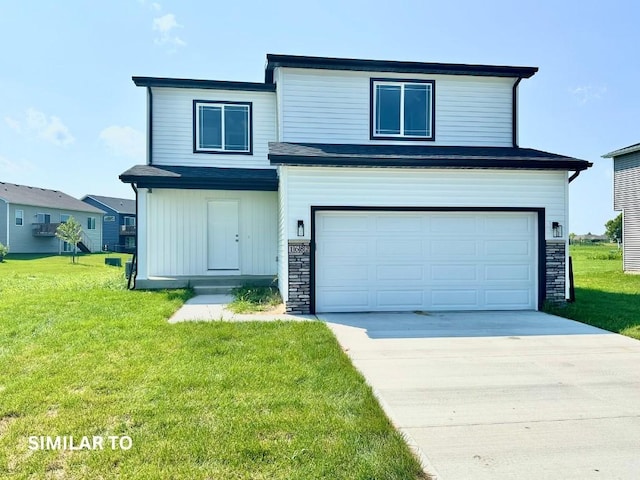 view of front facade with a front yard and a garage