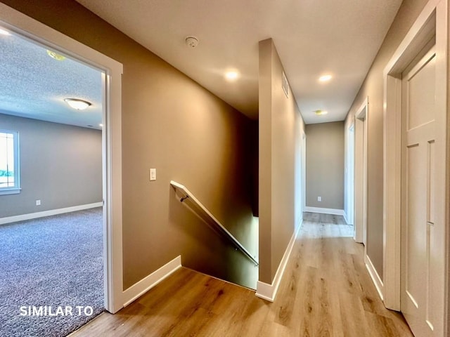 hallway with light wood-type flooring