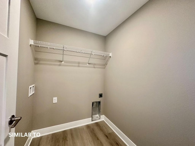 clothes washing area with hookup for an electric dryer, wood-type flooring, and hookup for a washing machine