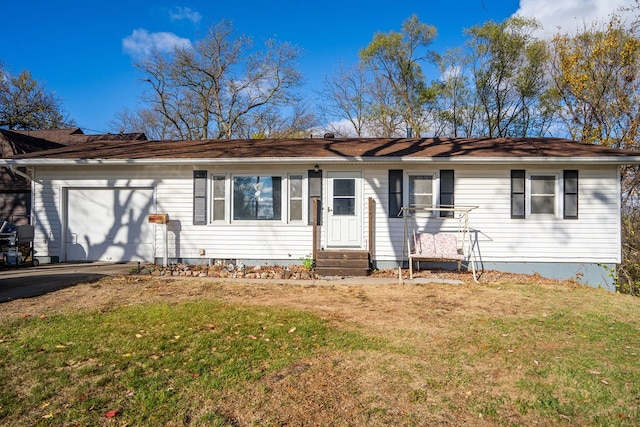 single story home featuring a garage and a front yard