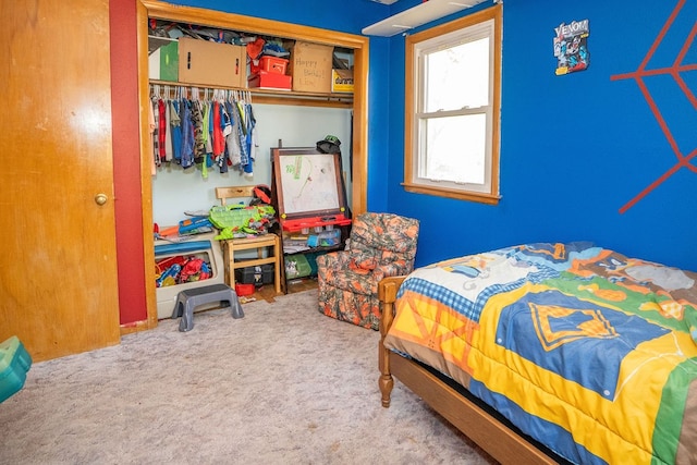 carpeted bedroom with a closet