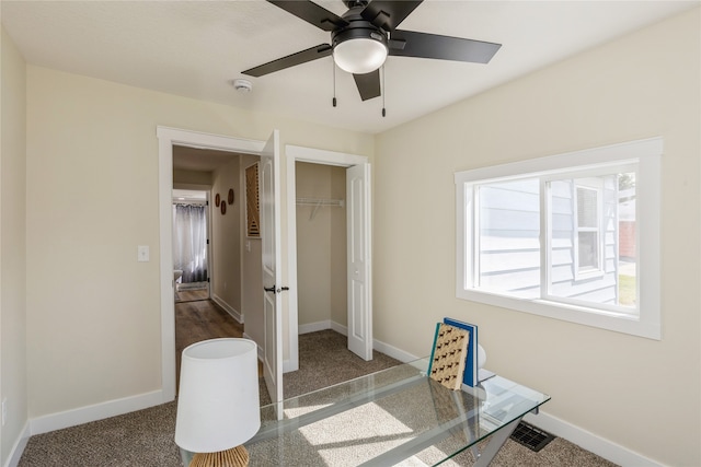 office space with ceiling fan