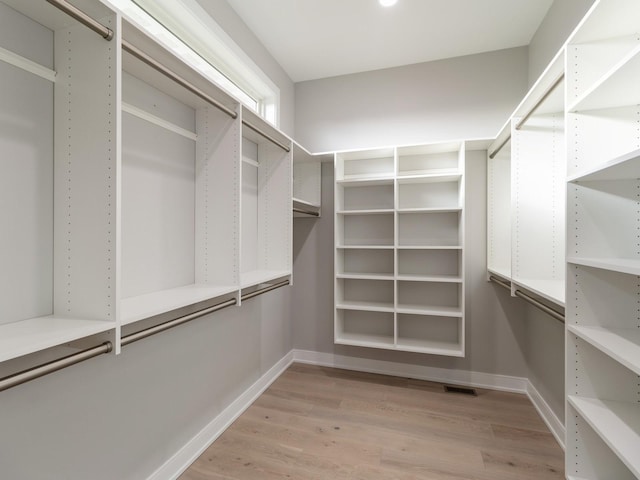 18176 Alderleaf Dr, Clive, IA 50325 - walk in closet featuring light wood finished floors