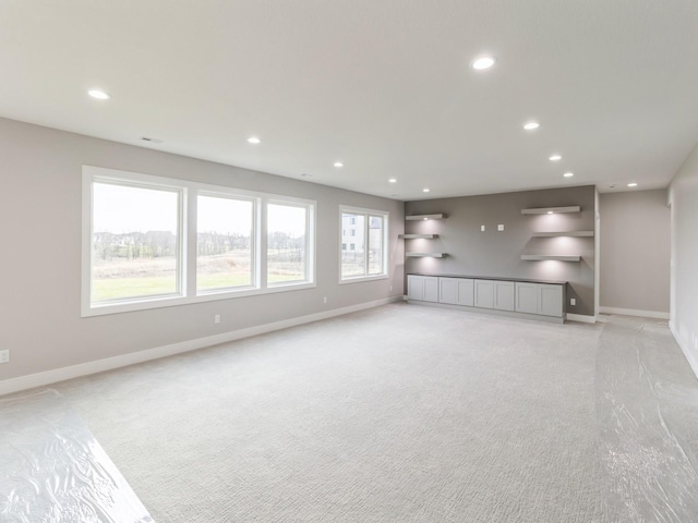18176 Alderleaf Dr, Clive, IA 50325 - spare room featuring light carpet, baseboards, and recessed lighting