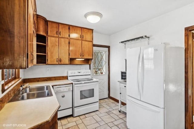 kitchen with sink and white appliances