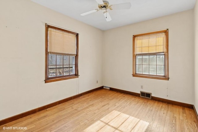 spare room featuring ceiling fan and light hardwood / wood-style floors