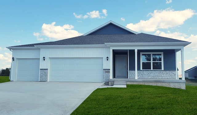 view of front of house with a garage and a front lawn