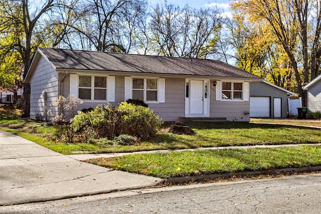 single story home featuring a garage and a front lawn