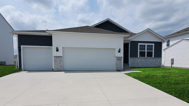 ranch-style home with a garage, concrete driveway, stone siding, and a front lawn