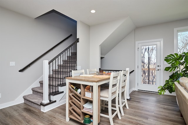 dining space with hardwood / wood-style floors