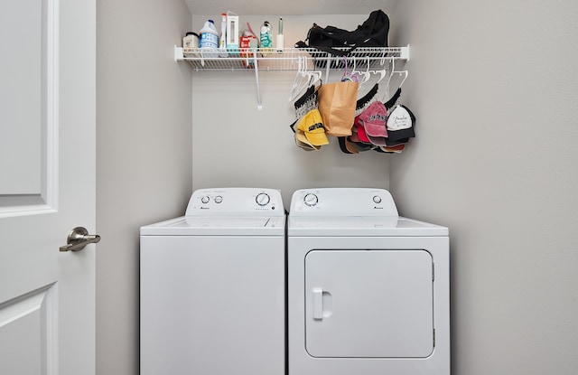 washroom with washing machine and dryer