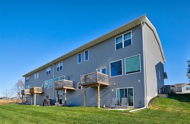 back of property with a patio and a yard