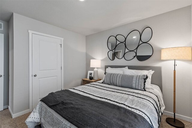 bedroom featuring light carpet