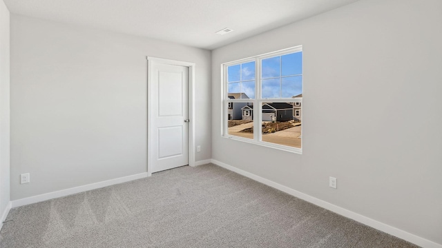 unfurnished room with carpet floors