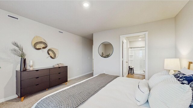1007 Daisy Ln, Waukee, IA 50263 - carpeted bedroom featuring ensuite bathroom
