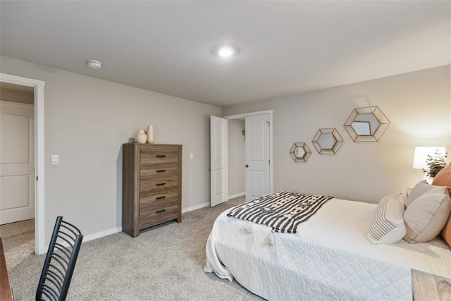 bedroom featuring light colored carpet