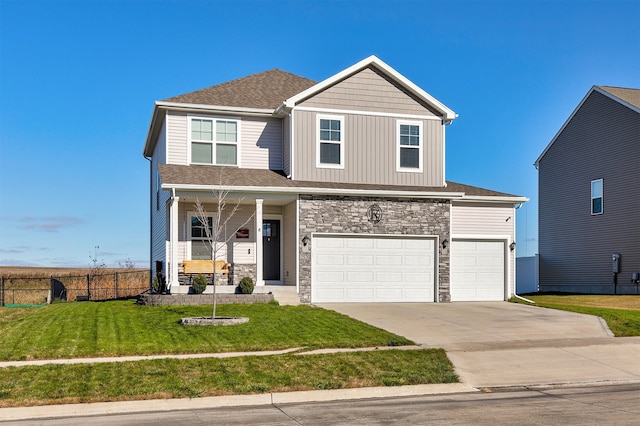 front of property with a front lawn and a garage