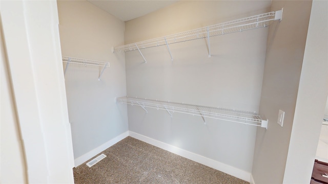 walk in closet with carpet flooring and visible vents