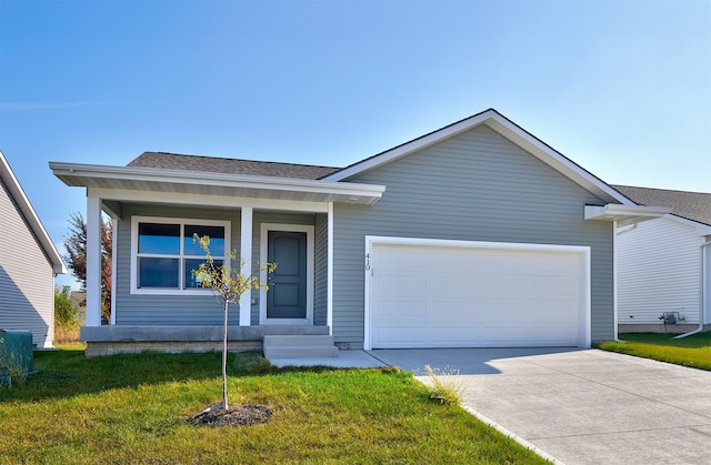 single story home with a garage and a front lawn